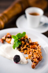 Sticker - Dry breakfast Crunchy granola bowl with flax seeds on a table. Healthy and fiber food. Breakfast time