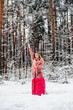 girl votes in the woods by a broken car.Winter forest, frost and snow