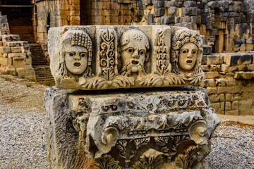 Wall Mural - Stone faces bas relief at the Myra ancient city. Demre, Turkey