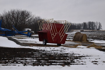 Sticker - Farm Equipment and Hay Bales in a Snowy Field