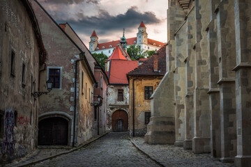 Poster - Farska Street in Historical Centre of Bratislava, Slovakia at Sunset with Bratislava Castle in Background