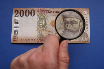 Wall Mural - Hungarian 2000 forint banknote, on it Gábor Bethlen portrait. Examine through the magnifying glass. Bank image and photo.