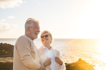 close up and portrait of two happy and active seniors or pensioners having fun and enjoying looking 