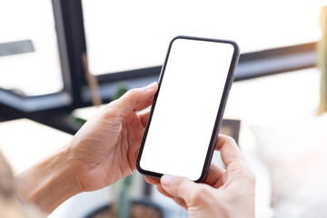 cell phone blank white screen mockup.woman hand holding texting using mobile on desk at office.background empty space for advertise.work people contact marketing business,technology