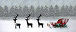 A long landscape of a red sleigh and reindeer with snowy trees in the background.