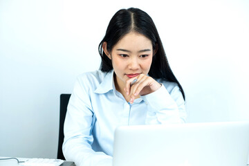 Working Asian women feel stressed, dismal tired from work, migraine headaches from hard work while working at the office