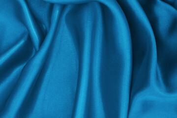 Dark blue fabric texture background, detail of silk or linen pattern.