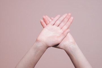 Wall Mural - Two crossed female hands showing stop gesture. Preventing domestic violence and abuse concept