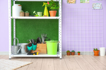 Poster - Set of gardening supplies and houseplants in barn