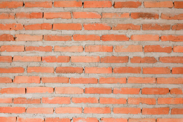 Wall Mural - close up on retro grunge orange brick wall background for architectural exterior buildings material concept.	