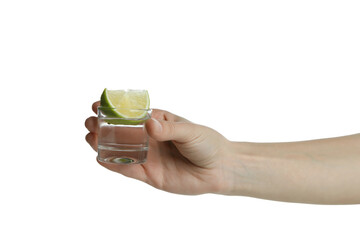 Female hand hold shot of vodka or tequila with lime, isolated on white background