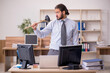 © Elnur - Young male employee holding plunger in funny concept