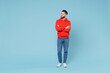 Full length young caucasian smiling bearded handsome student man 20s wearing casual red orange hoodie hold hands crossed folded isolated on blue background studio portrait People lifestyle concept.