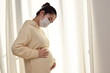 © SaitoFAM - A pregnant woman in her twenties wears a mask for prevention because she is afraid of coronavirus and pollen.