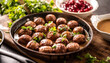 Swedish meatballs, kottbullar, in a pan topped with fresh parsley