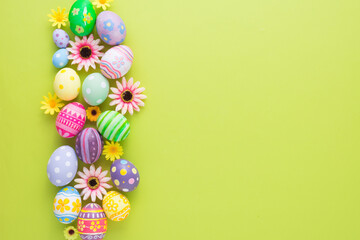 Happy Easter day colorful eggs and flower decoration on paper background with copy space