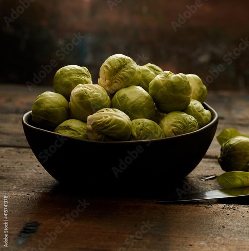Bowl of organic Brussels sprouts on lumber table © exclusive-design
