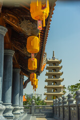 Wall Mural - Beautiful traditional yellow silk lanterns are are hanging on the roof of the temple at Vinh Nghiem monastery in Ho Chi Minh city, Vietnam