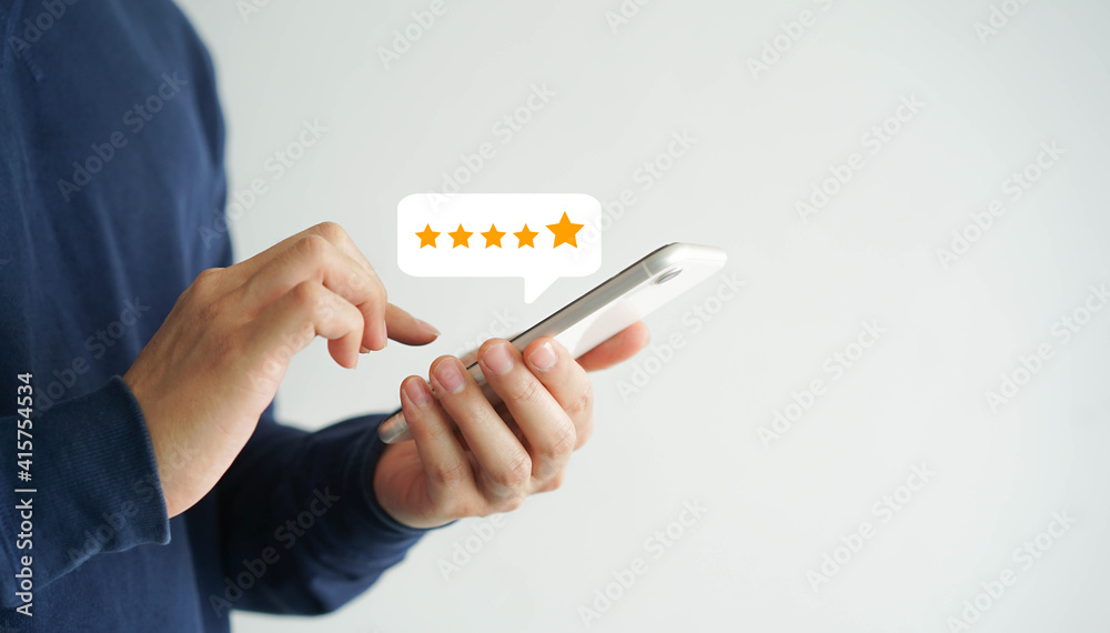 close up on customer man hand pressing on smartphone screen with gold five star rating feedback icon and press level three rank (good) for give score point to review the service business concept	 - obrazy, fototapety, plakaty 
