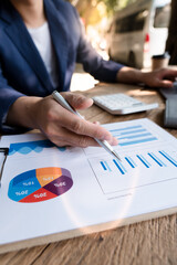 Business people working with graphs, business documents on their desks to analyze for business startups.