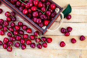 Wall Mural - Ripe cherries in a wooden box.