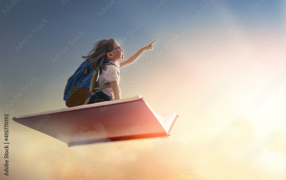 child flying on the book - obrazy, fototapety, plakaty 