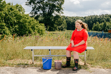 Chubby young girl sitting on the bench