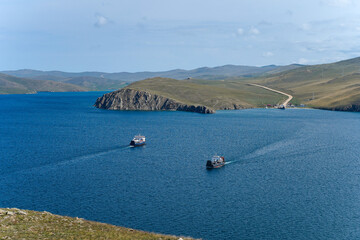 View of sea, peninsula and the ships. Ferry. Transportation from mainland to peninsula. Blue water