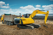 A Large Construction Excavator Of Yellow Color On The Construction Site In A Quarry For Quarrying. Industrial Image