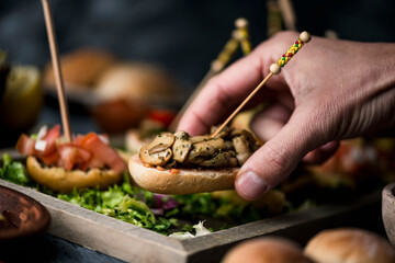 Poster - man takes a vegan spanish pincho