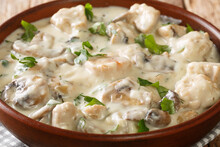Ciulama De Pui Is A Romanian Creamed Chicken Dish With Mushrooms Closeup In The Bowl On The Table. Horizontal