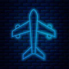 Poster - Glowing neon line Plane icon isolated on brick wall background. Flying airplane. Airliner insurance. Security, safety, protection, protect concept. Vector.