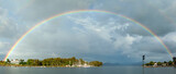 Fototapeta Tęcza - Rainbow over the coastal town of Psathaki and its lagoon, near Preveza city, in Epirus region, Greece, Europe
