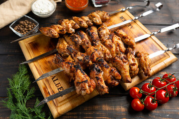 grilled or barbecue chicken wings skewer on board