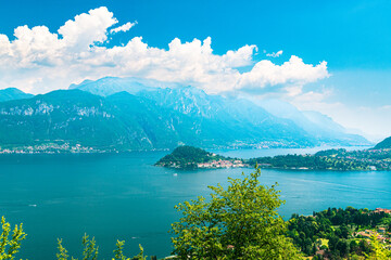 Aerial panoramic view of Bellagio, Italy. The two branches of Lake Como are visibile. Blue sky, alps and white clouds on the background.