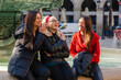Candid portrait of three women friends having fun in mediterranean city