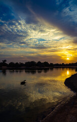Wall Mural - sunrise over the river at qudra lake