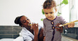 © Flamingo Images - Cute little girl learning to brush her teeth with her mother