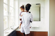© Flamingo Images - Little girl learning how to brush her teeth with her mom