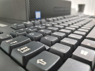 Selective focus shot of a black computer keyboard