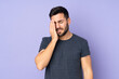 © luismolinero - Caucasian handsome man with headache over isolated purple background
