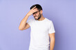 © luismolinero - Caucasian handsome man over isolated background with headache