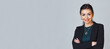 Portrait of a confident smiling senior business woman with arms folded. Horizontal banner. Copyspace.