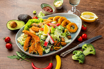 Wall Mural - Seafood and vegetable salad. Shrimps, mussels, squid rings