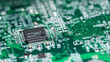 © Dmitriy D - Fragment of a green computer printed circuit board with selective focus on an abstract microchip, horizontal panoramic