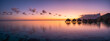 © JCB - Panoramic sunset view at a luxury beach resort in the tropics