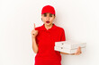 © Asier - Young skinny arab pizza delivery girl having an idea, inspiration concept.