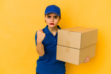 Young skinny delivery arab girl showing fist to camera, aggressive facial expression.