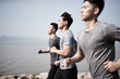 © imtmphoto - three young asian men running outdoors