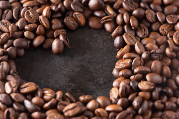 Roasted coffee beans on a dark background